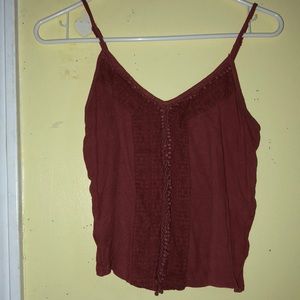 burnt orange colored tank.